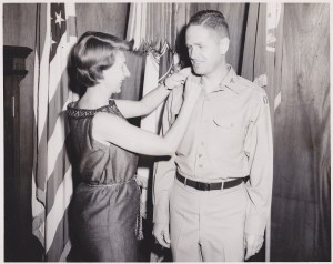 A look of pride between a soldier and his wife...